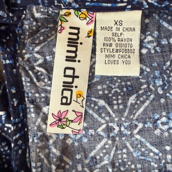 Mimi Chica women's romper with a blue geometric pattern and pom pom trim XS - Picture 6 of 6